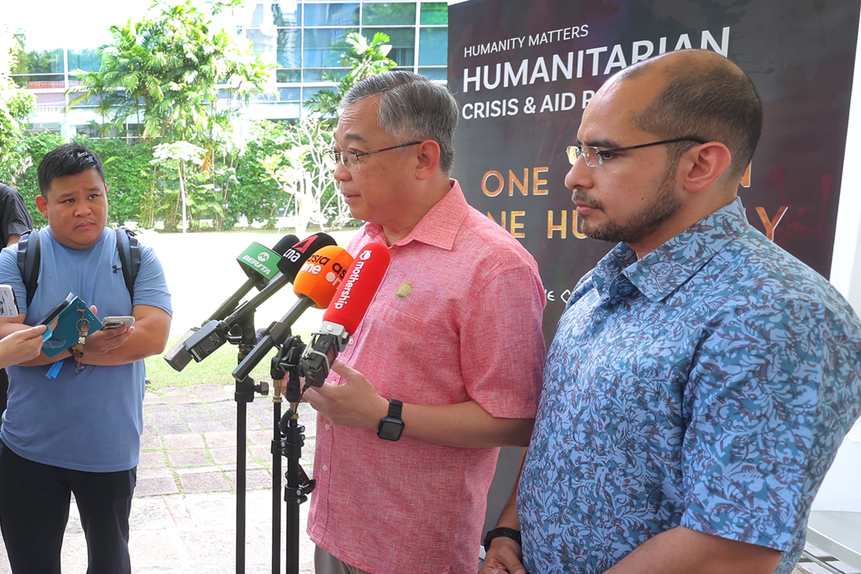 DPM Gan Kim Yong at the Humanity Matters Gaza Relief Street Collection media doorstop